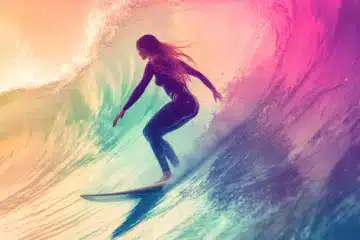 Woman surfing on rainbow colored waves