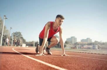 Man in the starting blocks on a track