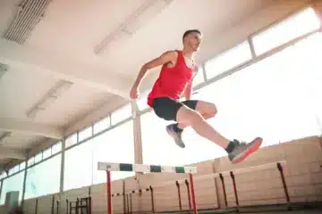 Man jumping over a hurdle