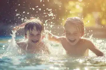 Two kids joyfully splashing around in water