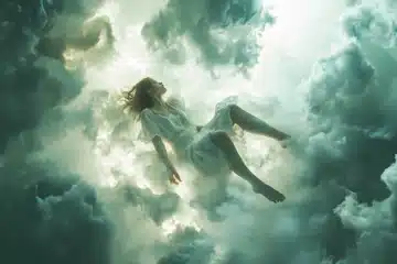 Woman floating in white clouds