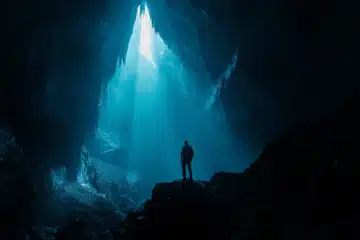 Man exploring a deep dark mysterious cavern